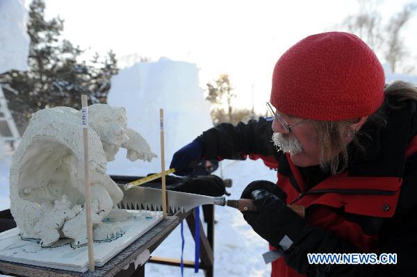 A contestant participates in a snow sculpture contest in Harbin, capital of northeast China's Heilongjiang Province, Jan. 10, 2011.