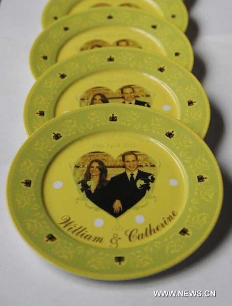 Photo taken on Jan. 10, 2011 shows the plates with the photo of Prince William and Kate Middleton on at a workshop of Tri-Ring Group Corporation in Beiliu City, south China's Guangxi Zhuang Autonomous Region. 