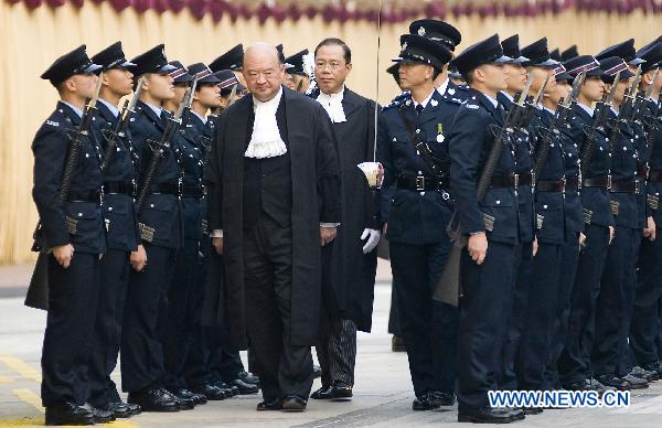 Geoffrey Ma Tao-li, Chief Justice of the Court of Final Appeal of Hong Kong Special Administrative Region, inspects the guard of honour of the Hong Kong Police Force during the Ceremonial Opening of the Legal Year 2011 in Hong Kong, south China, Jan. 10, 2011.