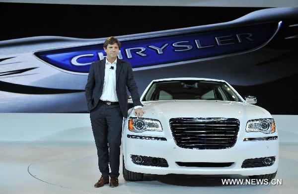 Olivier Francois, president and Chief Executive Officer of Chrysler brand, poses during the unveiling of the Chrysler 300 sedan at the North American International Auto Show (NAIAS) in Detroit, the United States, Jan. 10, 2011. 