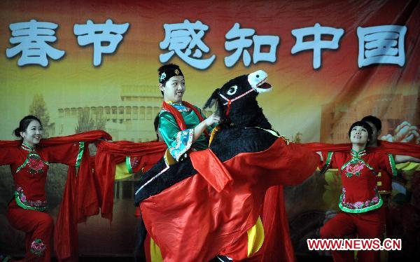 Chinese actors and actresses perform during a performance in Bishkek, Kyrgyzstan, Jan. 10, 2011. 