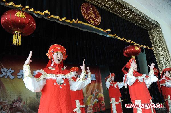 Chinese actresses perform during a performance in Bishkek, Kyrgyzstan, Jan. 10, 2011.
