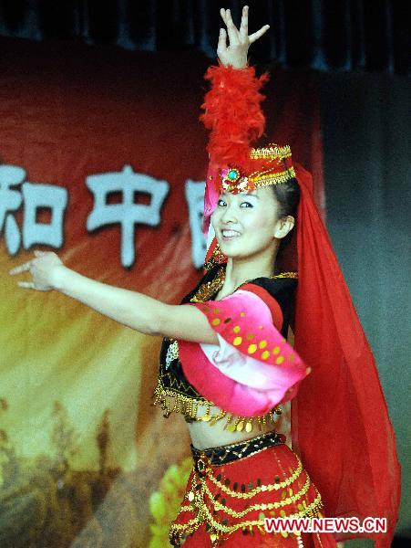A Chinese actress dances during a performance in Bishkek, Kyrgyzstan, Jan. 10, 2011. 
