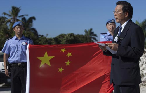 Chinese peacekeepers hold a memorial for fallen colleagues and other victims of the devastating earthquake that hit the Caribbean nation one year ago in Port au Prince, Jan 12, 2010.