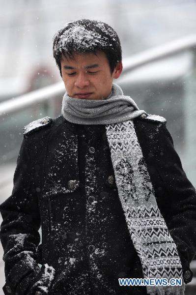 A pedestrian is seen in Guiyang, capital of southwest China&apos;s Guizhou Province, Jan. 17, 2011.