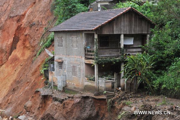 A house stands near the landslide area in Caleme slum, outside Teresopolis, Brazil, Jan. 16, 2011.