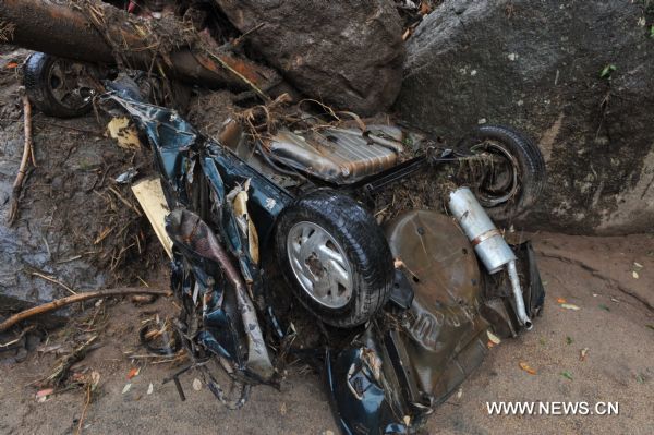 A car was destroyed during the landslide in Caleme slum, outside Teresopolis, Brazil, Jan. 16, 2011. 