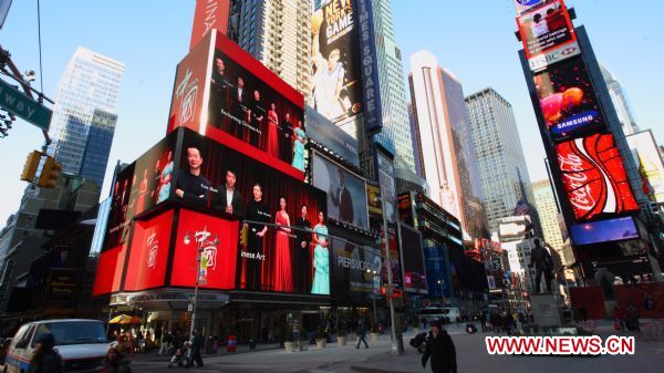 Footages of a short film promoting China (L) are shown on the screens at the Times Square in New York, US, Jan. 17, 2011. The video will be on until Feb. 14, 2011. 