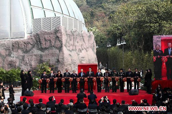 Chui Sai On (C), chief executive of the Macao Special Administrative Region, along with guests of honor, cuts the ribbon during the inauguration of Macao&apos;s panda pavilion in Macao, south China, Jan. 18, 2011.