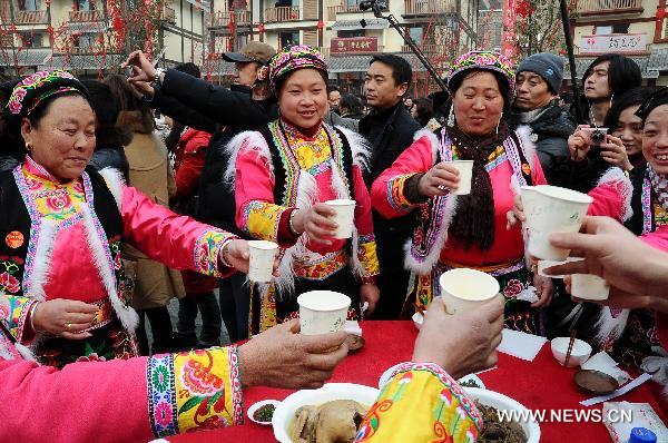 Local residents hold a grand public banquet to celebrate the coming Spring Festival in Yingxiu Town of Wenchuan County, southwest China's Sichuan Province, Jan. 31, 2011. 