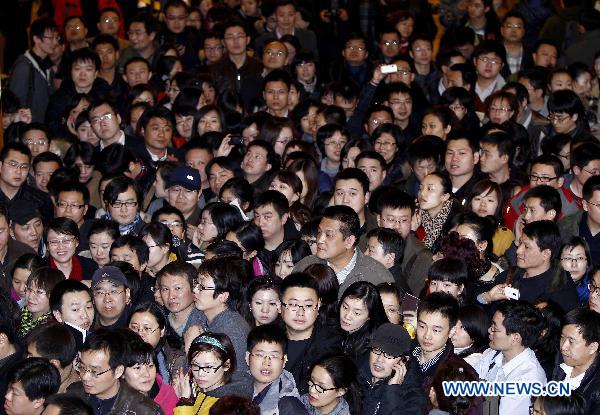 Journalists wait for information materials at an auditorium of Chinese People's Political Consultative Conference (CPPCC) in Beijing, capital of China, March 1, 2011. 