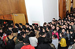 Journalists wait for information materials at an auditorium of Chinese People's Political Consultative Conference (CPPCC) in Beijing, capital of China, March 1, 2011.