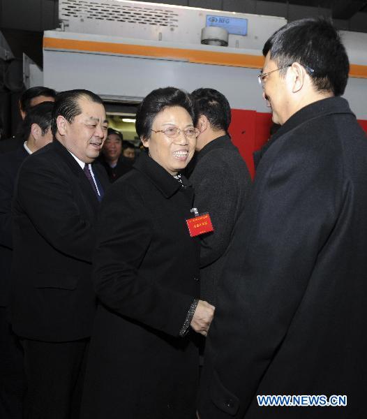 Deputies to the Fourth Session of the 11th National People's Congress (NPC) from central China's Henan Province arrive in Beijing, capital of China, March 2, 2011.