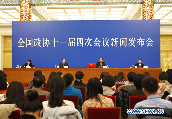Zhao Qizheng (2nd R), spokesman of the Fourth Session of the 11th Chinese People&apos;s Political Consultative Conference (CPPCC) National Committee, speaks during a news conference on the CPPCC session at the Great Hall of the People in Beijing, capital of China, March 2, 2011. 