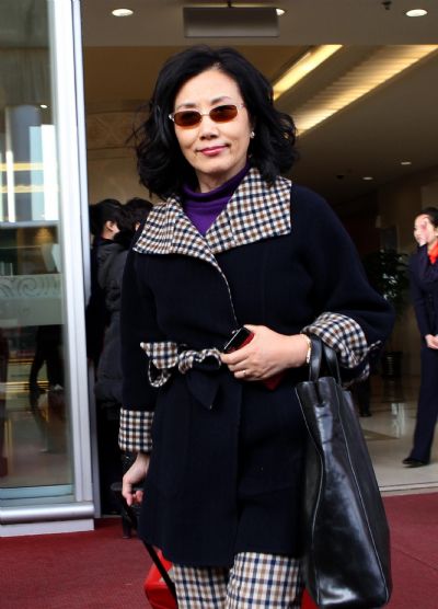 Lisa Wang Ming-chuen, a deputy to the Fourth Session of the 11th National People's Congress (NPC) from south China's Hong Kong Special Administrative Region arrives in Beijing, capital of China, March 2, 2011. 