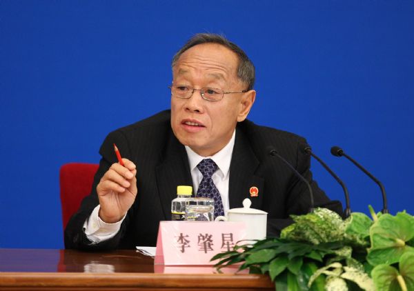 Li Zhaoxing, spokesman for the Fourth Session of the 11th National People's Congress (NPC), answers questions from journalists during the news conference on the Fourth Session of the 11th NPC at the Great Hall of the People in Beijing, capital of China, March 4, 2011. (Xinhua/Chen Jianli) (ly) 