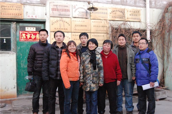 Ke Huixin (5th L), a member of the 11th National Committee of the Chinese People&apos;s Political Consultative Conference (CPPCC) and professor of the Communication University of China, visits Picun Village in the northeastern suburbs of Beijing on March 2, 2011. 