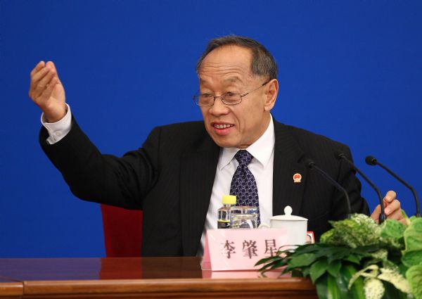 Li Zhaoxing, spokesman for the Fourth Session of the 11th National People's Congress (NPC), answers questions from journalists during the news conference on the Fourth Session of the 11th NPC at the Great Hall of the People in Beijing, capital of China, March 4, 2011. 