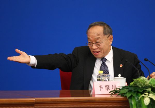 Li Zhaoxing, spokesman for the Fourth Session of the 11th National People's Congress (NPC), gestures as he answers questions from journalists during the news conference on the Fourth Session of the 11th NPC at the Great Hall of the People in Beijing, capital of China, March 4, 2011. 