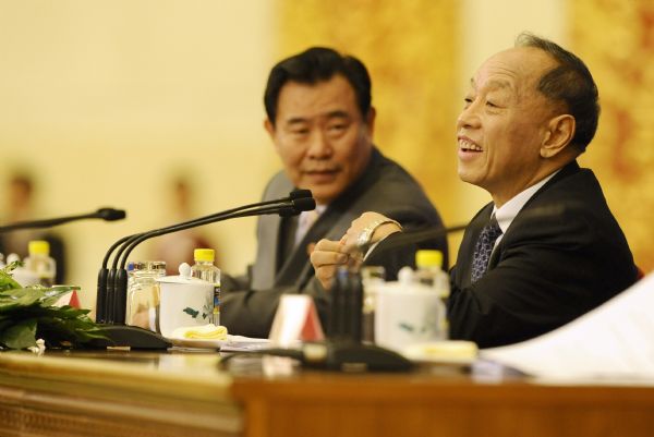 Li Zhaoxing (R), spokesman for the Fourth Session of the 11th National People's Congress (NPC), answers questions from journalists during the news conference on the Fourth Session of the 11th NPC at the Great Hall of the People in Beijing, capital of China, March 4, 2011. 