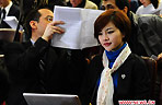 Journalists work during the opening meeting of the Fourth Session of the 11th National People's Congress (NPC) at the Great Hall of the People in Beijing, capital of China, March 5, 2011.