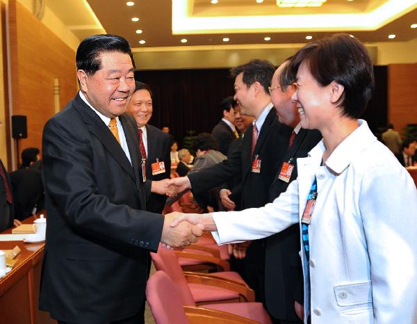 Chinese top political advisor Jia Qinglin joins in a panel discussion with national legislators from Beijing on March 5, 2011.