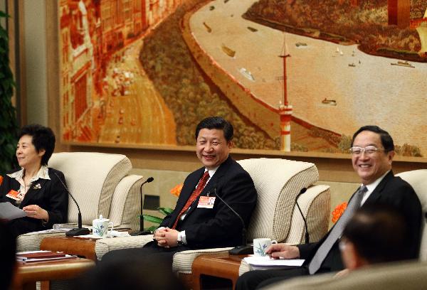 Chinese Vice President Xi Jinping joins in a panel discussion with national legislators from Shanghai on March 5, 2011.