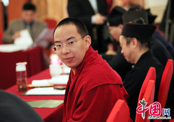 The 11th Panchen Lama, Bainqen Erdini Qoigyijabu, deliberates the government work report presented by Chinese Premier Wen Jiabao to the National People&apos;s Congress (NPC) with other political advisors at the annual session of the Chinese People&apos;s Political Consultative Conference (CPPCC).