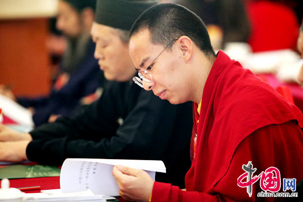 The 11th Panchen Lama, Bainqen Erdini Qoigyijabu, deliberates the government work report presented by Chinese Premier Wen Jiabao to the National People&apos;s Congress (NPC) with other political advisors at the annual session of the Chinese People&apos;s Political Consultative Conference (CPPCC).