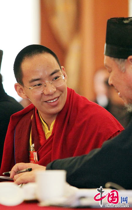 The 11th Panchen Lama, Bainqen Erdini Qoigyijabu, deliberates the government work report presented by Chinese Premier Wen Jiabao to the National People&apos;s Congress (NPC) with other political advisors at the annual session of the Chinese People&apos;s Political Consultative Conference (CPPCC).