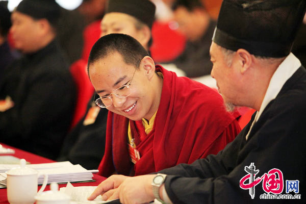 The 11th Panchen Lama, Bainqen Erdini Qoigyijabu, deliberates the government work report presented by Chinese Premier Wen Jiabao to the National People&apos;s Congress (NPC) with other political advisors at the annual session of the Chinese People&apos;s Political Consultative Conference (CPPCC).