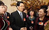 Chinese President Hu Jintao, who is also General Secretary of the Central Committee of the Communist Party of China (CPC) and Chairman of the Central Military Commission, talks with deputies to the Fourth Session of the 11th National People's Congress (NPC) from north China's Inner Mongolia Autonomous Region, in Beijing, capital of China, March 8, 2011. Hu Jintao joined in the discussion of the delegation on Tuesday.