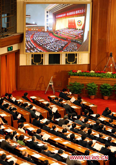 Members of the Fourth Session of the 11th National Committee of the Chinese People's Political Consultative Conference (CPPCC) attend the third plenary meeting of the Fourth Session of the 11th CPPCC National Committee at the Great Hall of the People in Beijing, capital of China, March 9, 2011. 