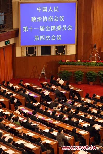 Members of the Fourth Session of the 11th National Committee of the Chinese People's Political Consultative Conference (CPPCC) attend the third plenary meeting of the Fourth Session of the 11th CPPCC National Committee at the Great Hall of the People in Beijing, capital of China, March 9, 2011.