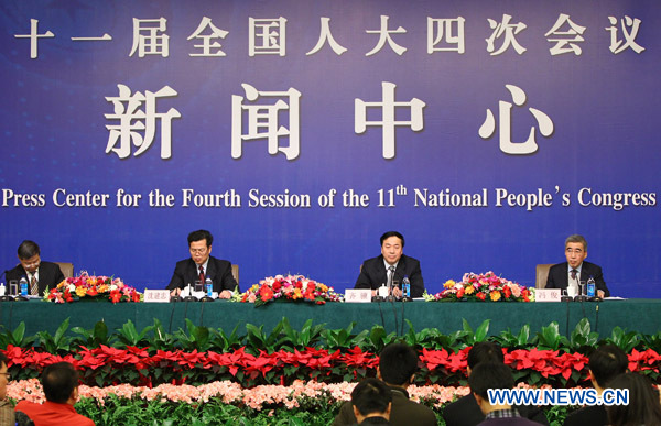 Qi Ji (2nd Right), vice minister of House and Urban-Rural Construction, Shen Jianzhong (2nd Left), director of Real Estate Market Supervision Department, and Feng Jun (R), director of Indemnificatory Housing Department,attend a news conference of the Fourth Session of the 11th National People's Congress (NPC) focusing on indemnificatory housing construction and regulation of the real estate market in Beijing, capital of China, March 9, 2011.