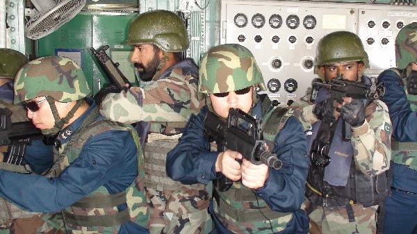 Chinese Navy soldiers and Pakistani anti-terrorism squad members take part in the 'Peace-11 Exercises' multinational naval exercises in Karachi, Pakistan, March. 9, 2011.