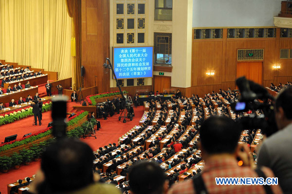 The Fourth Session of the 11th National People&apos;s Congress holds its closing meeting at the Great Hall of the People in Beijing, China, March 14, 2011. 