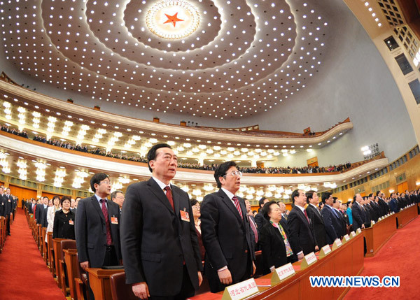 Deputies to the Fourth Session of the 11th National People's Congress (NPC) sing the national anthem during the closing meeting of the Fourth Session of the 11th NPC at the Great Hall of the People in Beijing, China, March 14, 2011.