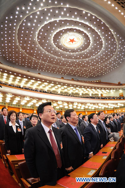 Deputies to the Fourth Session of the 11th National People&apos;s Congress (NPC) sing the national anthem during the closing meeting of the Fourth Session of the 11th NPC at the Great Hall of the People in Beijing, China, March 14, 2011.