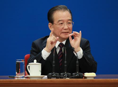 Chinese Premier Wen Jiabao meets the press after the closing meeting of the Fourth Session of the 11th National People&apos;s Congress (NPC) at the Great Hall of the People in Beijing, capital of China, March 14, 2011.