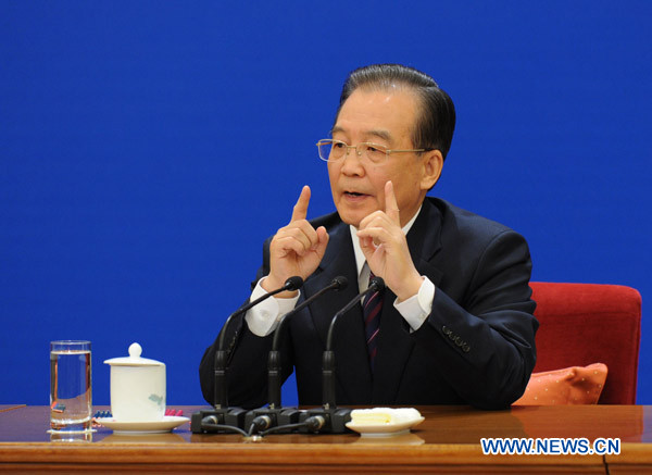 Chinese Premier Wen Jiabao answers questions during a press conference after the closing meeting of the Fourth Session of the 11th National People&apos;s Congress (NPC) at the Great Hall of the People in Beijing, China, March 14, 2011. 