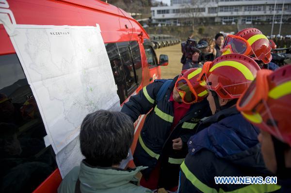 Members of the Chinese International Search and Rescue Team (CISAR) prepare to work after arriving at the earthquake hit Ofunato city in Iwate prefecture, Japan, March 14, 2011. 