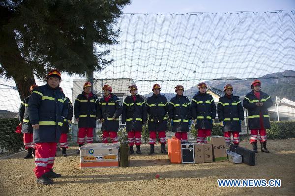 Members of the Chinese International Search and Rescue Team (CISAR) stand by upon their arrival at the earthquake hit Ofunato city in Iwate prefecture, Japan, March 14, 2011. 