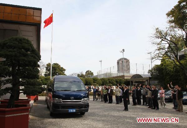 Working staff of the Chinese Embassy in Japan see off the third working group in Tokyo, Japan, March 14, 2011.