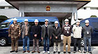 Members of the working group of the Chinese Embassy pose for a group photo before their departure in Tokyo, March 14, 2011.