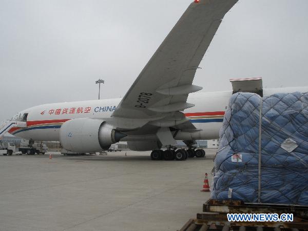 Relief goods offered by Chinese government to quake-hit Japan are ready for loading in Shanghai Pudong International Airport in Shanghai, east China, March 14, 2011.