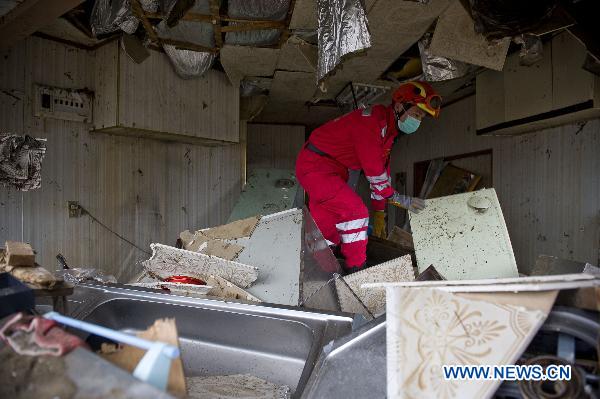 A member of the Chinese International Search and Rescue Team (CISAR) works at the quake-shaken Ofunato city in Iwate prefecture, Japan, March 15, 2011. 