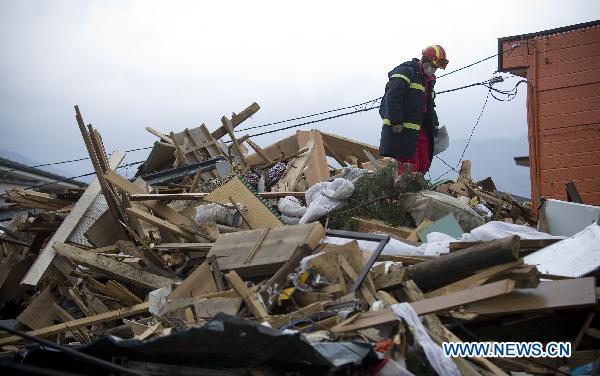 A member of the Chinese International Search and Rescue Team (CISAR) works at the quake-shaken Ofunato city in Iwate prefecture, Japan, March 15, 2011.