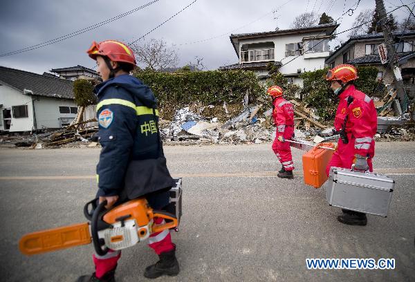 Members of the Chinese International Search and Rescue Team (CISAR) work at the quake-shaken Ofunato city in Iwate prefecture, Japan, March 15, 2011.