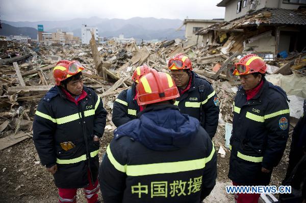 Members of the Chinese International Search and Rescue Team (CISAR) work at the quake-shaken Ofunato city in Iwate prefecture, Japan, March 15, 2011. 